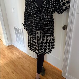 Stylish Anthropologie houndstooth wrap coat with two buttons and belt.
